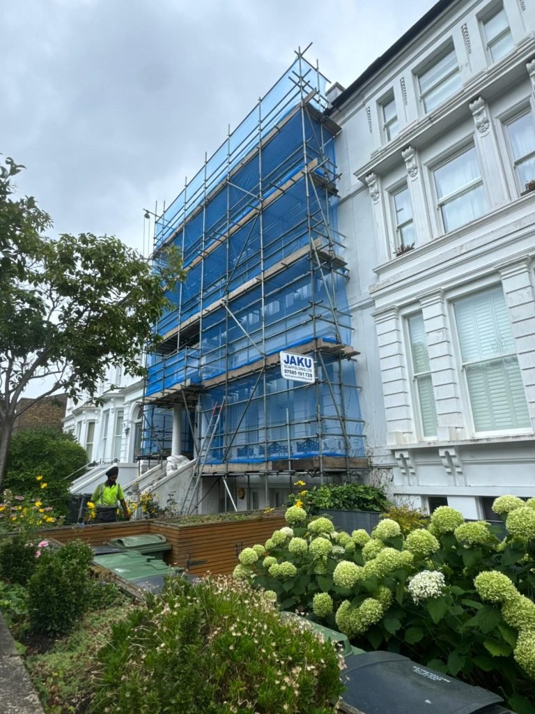 Residential scaffolding installation in London by Jaku Scaffolding with blue netting for exterior renovation