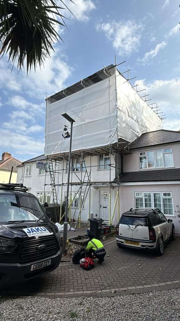 Temporary roof scaffolding at residential property in Staveley Gardens, London W4, built on private land without licence requirement.
