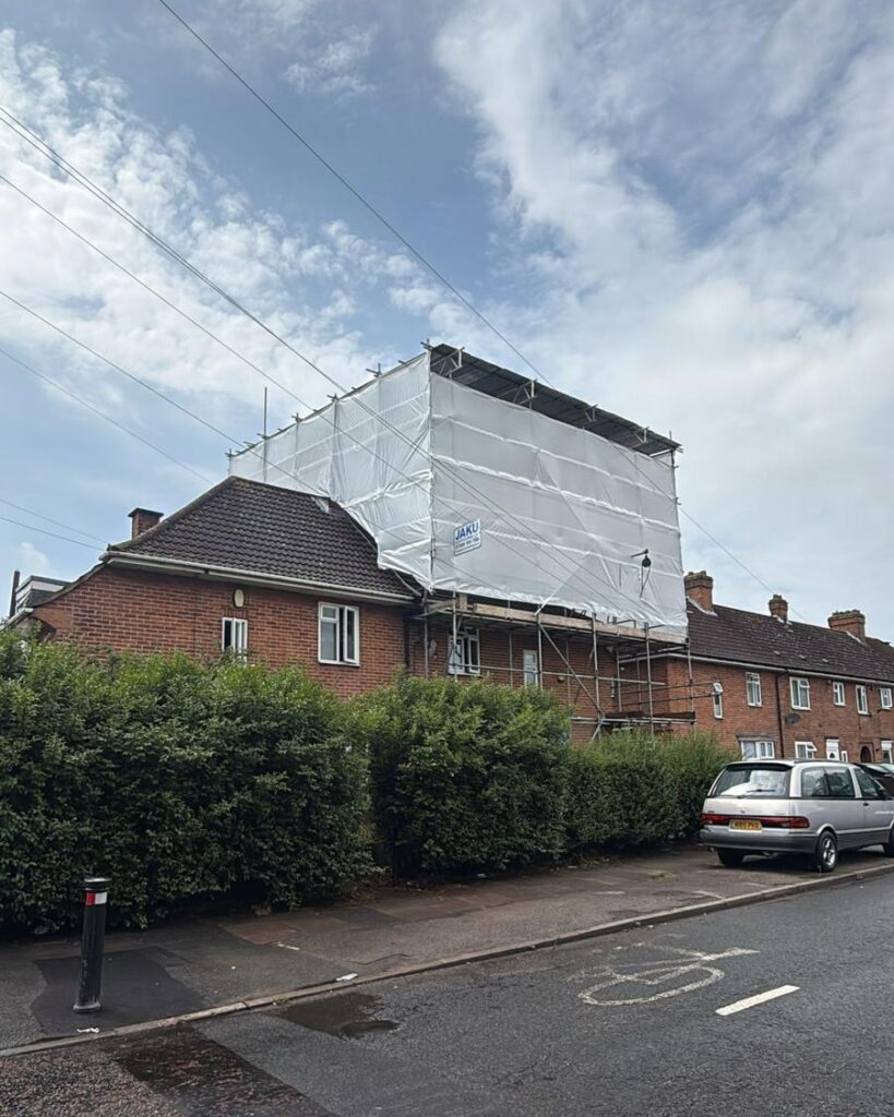 Temporary roof scaffolding in Lewisham on Brookehowse Road SE6, erected by Jaku Scaffolding for weather protection during roof works.