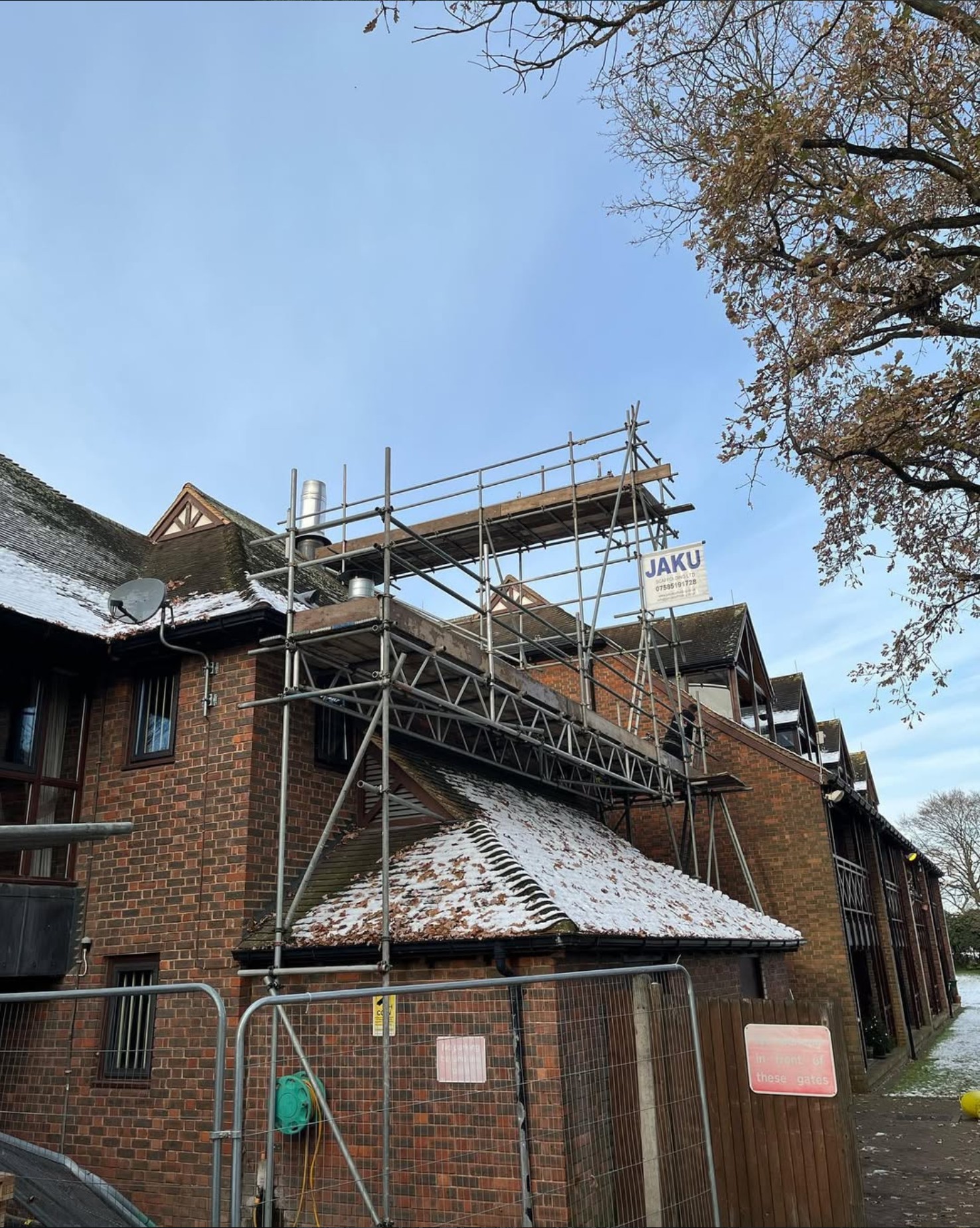 Chimney scaffold hire installation on a residential property showing safe access platforms erected by Jaku Scaffolding.